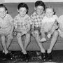 With siblings c1952